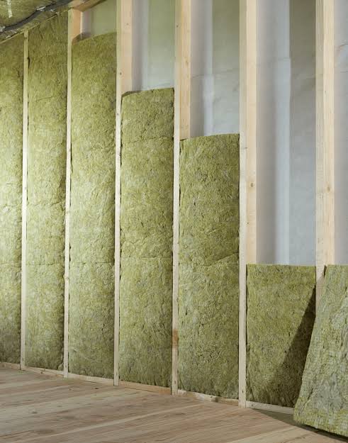 Rock Wool insulation batts fitted between wall studs during a building partition installation.